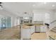 Bright kitchen with granite countertops and stainless-steel appliances, overlooking the living area at 707 9Th Sw Ave, Ruskin, FL 33570