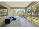 Screened lanai with seating and view of playground at 707 9Th Sw Ave, Ruskin, FL 33570
