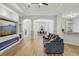 Bright and airy living room with modern built-ins, an open layout, and stylish hardwood floors at 707 9Th Sw Ave, Ruskin, FL 33570