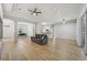 Spacious living room featuring hardwood floors and open floor plan to kitchen and dining area at 707 9Th Sw Ave, Ruskin, FL 33570