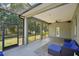 Relaxing screened-in patio featuring a ceiling fan and outdoor seating for enjoying tranquil moments outdoors at 707 9Th Sw Ave, Ruskin, FL 33570