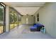 Spacious screened-in patio with ceiling fan, outdoor seating, and view of the backyard perfect for entertainment at 707 9Th Sw Ave, Ruskin, FL 33570