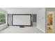 Theater room with large screen and adjacent bathroom at 707 9Th Sw Ave, Ruskin, FL 33570