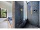 Close-up of the bathroom tiled shower at 707 Warren Rd, Lutz, FL 33548