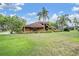 Charming single-Gathering home with mature landscaping and a well-manicured lawn at 707 Warren Rd, Lutz, FL 33548