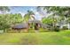 Charming single-Gathering home with mature landscaping and a well-manicured lawn at 707 Warren Rd, Lutz, FL 33548