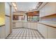 Bright kitchen with white cabinets and tiled floor, complete with modern appliances at 707 Warren Rd, Lutz, FL 33548