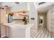 Cozy kitchen area with breakfast bar, white cabinets and modern appliances at 707 Warren Rd, Lutz, FL 33548