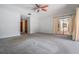 Living room features carpeted flooring and neutral paint at 707 Warren Rd, Lutz, FL 33548