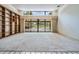 Open living room featuring a pool view and large windows, providing abundant natural light at 707 Warren Rd, Lutz, FL 33548