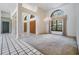 Expansive living room with high ceilings, chandelier lighting and large windows at 707 Warren Rd, Lutz, FL 33548