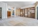 Spacious living room with built-in shelving and large windows for natural light at 707 Warren Rd, Lutz, FL 33548