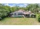 A screened in pool located in the back of the home at 707 Warren Rd, Lutz, FL 33548