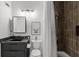 Bathroom features a modern vanity with granite counters and tiled shower/tub at 727 Coral Reef Dr, Tampa, FL 33602