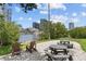 Waterfront community area offers picnic tables, chairs, beautiful landscaping and city views at 727 Coral Reef Dr, Tampa, FL 33602