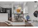 Chic dining area with modern chandelier, stylish seating, and black-and-white accents offers sophisticated dining at 727 Coral Reef Dr, Tampa, FL 33602