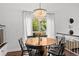 Cozy dining room features chandelier, natural light and offers a stylish space for meals at 727 Coral Reef Dr, Tampa, FL 33602
