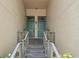 Close-up of double door entrance with metal railing leading to front door at 727 Coral Reef Dr, Tampa, FL 33602