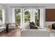 Bright and airy living room with wood floors and sliding glass doors to balcony at 727 Coral Reef Dr, Tampa, FL 33602