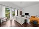 Bright and airy living room with wood floors and sliding glass doors to balcony at 727 Coral Reef Dr, Tampa, FL 33602