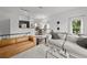 Bright living room features sleek furniture, hardwood floors, and stylish decor for comfortable living at 727 Coral Reef Dr, Tampa, FL 33602