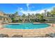 Enjoy this luxurious swimming pool with ample lounge seating and well-maintained landscaping at 727 Coral Reef Dr, Tampa, FL 33602