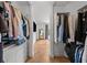 Bright walk-in closet with custom shelving and herringbone floors at 727 Coral Reef Dr, Tampa, FL 33602
