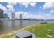 Scenic water view of the channel with picnic table, bench, grassy area and city buildings at 727 Coral Reef Dr, Tampa, FL 33602