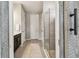 Bathroom showcasing a frameless glass shower, a white rug, and a view of the water closet at 751 Cajeput Loop, Tarpon Springs, FL 34689