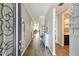 Inviting entryway showcasing wood-look tile flooring and views into the living spaces at 751 Cajeput Loop, Tarpon Springs, FL 34689