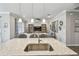 Open-concept view from the kitchen island into the living area at 751 Cajeput Loop, Tarpon Springs, FL 34689
