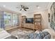 Inviting living room with stylish furniture, wood floors, and a media center at 751 Cajeput Loop, Tarpon Springs, FL 34689