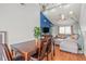 Open-concept dining room next to the living room features hardwood floors and stylish lighting at 7591 121St Ter, Largo, FL 33773