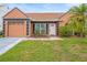 Charming single-story home with a well-maintained lawn and a cozy front entrance at 7591 121St Ter, Largo, FL 33773