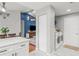 A view showing laundry area located off kitchen and living room with blue accent wall at 7591 121St Ter, Largo, FL 33773