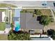 Overhead view of the property featuring a backyard pool, patio, and well-maintained landscaping at 829 Riverside Dr, Tarpon Springs, FL 34689