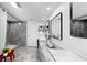 Bright bathroom featuring dual sinks, updated shower, and ample space at 829 Riverside Dr, Tarpon Springs, FL 34689
