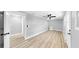 Spacious bedroom with a modern ceiling fan, wood-look flooring, and neutral paint at 829 Riverside Dr, Tarpon Springs, FL 34689