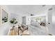 Bright bedroom with a plush chair, serene lighting, and contemporary decor at 829 Riverside Dr, Tarpon Springs, FL 34689