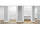 Walk-in closets with shelving, and wood-look floors at 829 Riverside Dr, Tarpon Springs, FL 34689