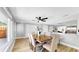 Bright dining room features a modern ceiling fan, wood floors, and lots of natural light at 829 Riverside Dr, Tarpon Springs, FL 34689