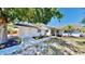 Charming single-story home with fresh exterior paint, walkway, and manicured front yard at 829 Riverside Dr, Tarpon Springs, FL 34689