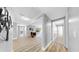 Entry hallway featuring modern décor, wood-look flooring, and access to several rooms at 829 Riverside Dr, Tarpon Springs, FL 34689