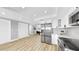 Spacious kitchen layout with stainless steel refrigerator and modern appliances at 829 Riverside Dr, Tarpon Springs, FL 34689