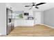 Clean and open kitchen featuring modern appliances and a view of the backyard at 829 Riverside Dr, Tarpon Springs, FL 34689