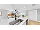 Kitchen island with sink and stylish faucet at 829 Riverside Dr, Tarpon Springs, FL 34689