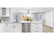 Clean kitchen island featuring modern stainless steel dishwasher at 829 Riverside Dr, Tarpon Springs, FL 34689