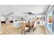 Bright and airy open-concept layout with living, dining, and kitchen areas, featuring modern finishes and wood floors at 829 Riverside Dr, Tarpon Springs, FL 34689