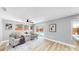 Cozy living room featuring a view of the pool and access to the backyard at 829 Riverside Dr, Tarpon Springs, FL 34689