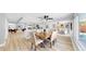 Inviting open-concept space with seamless flow between the living room, dining area, and kitchen, flooded with natural light at 829 Riverside Dr, Tarpon Springs, FL 34689